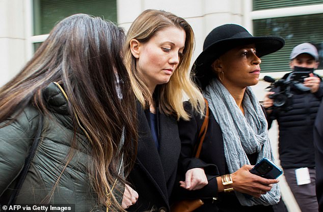 Seen in October after the sentencing of NXIVM leader Keith Raniere: Clyne, center, avoided any direct charges in connection with her involvement in the cult