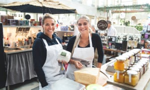 Staff at a stall at Kville Saluhall food market