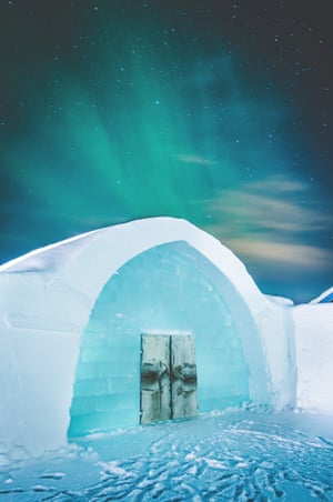 The Icehotel in northern Sweden with the northern lights.