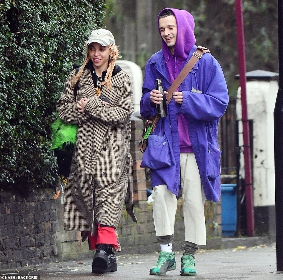 Edgy style: She also had on a casual pair of baggy scarlet pants covered in thick black patches