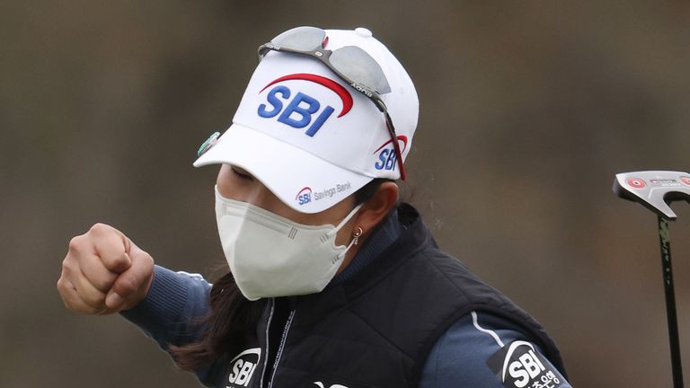 Kim celebrates holing her putt for birdie at the 18th