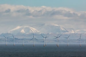 Robin Rigg Wind Farm and the Cumbrian fells from Balcary Point, Dumfries and Galloway, Scotland.