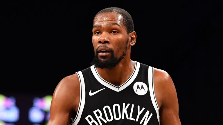 Landry Shamet #13 and Kevin Durant #7 of the Brooklyn Nets hi-five during the game against the Golden State Warriors on December 22, 2020