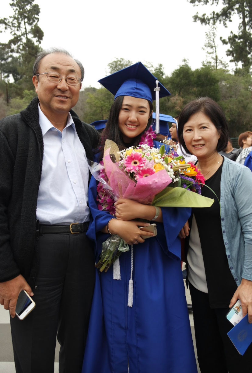 Kim with her parents in 2016.