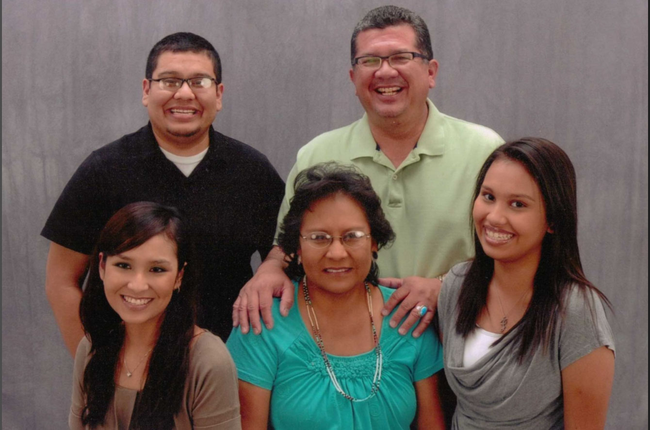 Michael Kellogg (top right), his late wife Gloria (bottom center) and their three children pose for a 2015 family photo. Kellogg says the Farmington, N.M., family was laughing at his niece, who was telling jokes in the background. “That caught us in our natural setting,” he says.