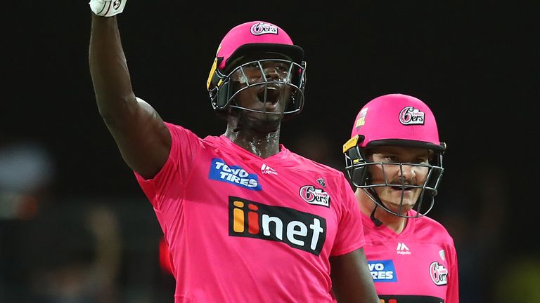 Jason Holder celebrates after powering Sydney Sixers to victory over Melbourne Renegades in the last over