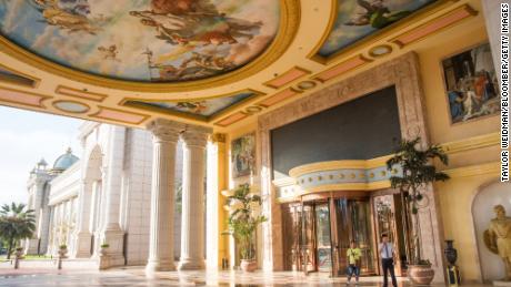 A security guard stands at an entrance to a building in the Kings Romans Casino in this file photograph from 2017