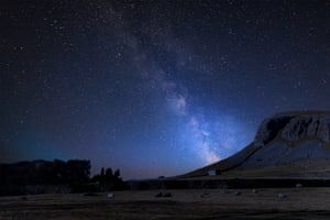 Milky Way composite image, Norber Ridge and stone barn in Yorkshire Dales national park.