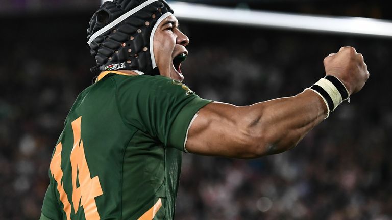 Cheslin Kolbe celebrates after scoring a try against England in the World Cup final