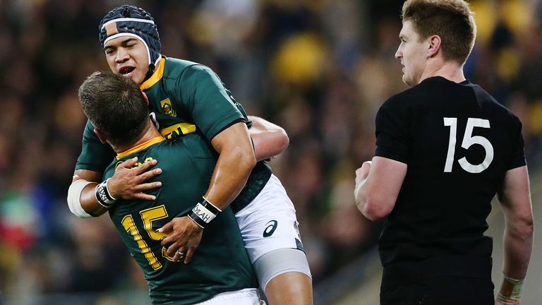 Cheslin Kolbe is congratulated by Willie le Roux after scoring his first Test try