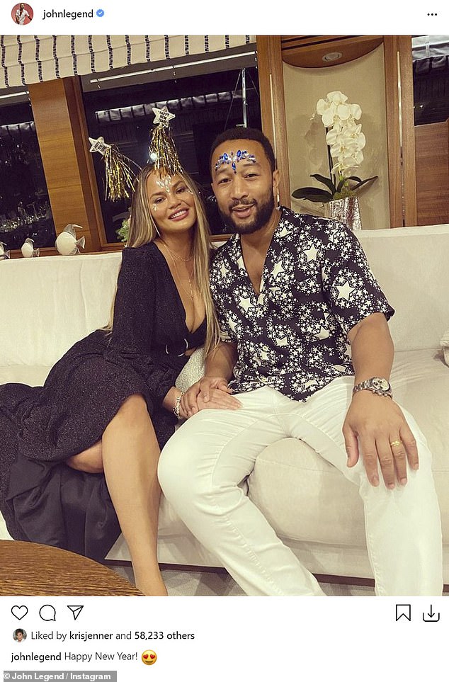 Celebrity couple: Chrissy added a sparkly headdress as she posed cuddled up to her Grammy-winning husband