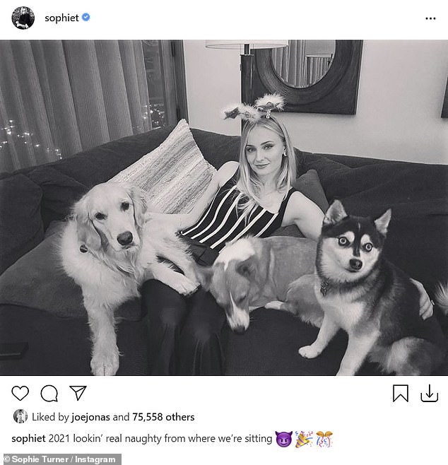 Oohh-la-la: The Game Of Thrones actress, 24, also posed in a sexy outfit with the couple's dogs