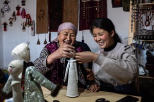 Buunisa Termechikova shows a participant how to make doll’s hair during a masterclass in the work room of the ethnic museum in Sary-Mogol.