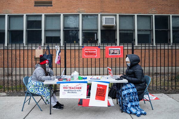 Teachers set up their computers and materials for virtual classes outside of Chicago’s Suder Montessori Magnet Elementary School in solidarity with pre-K educators ordered back into the building. 