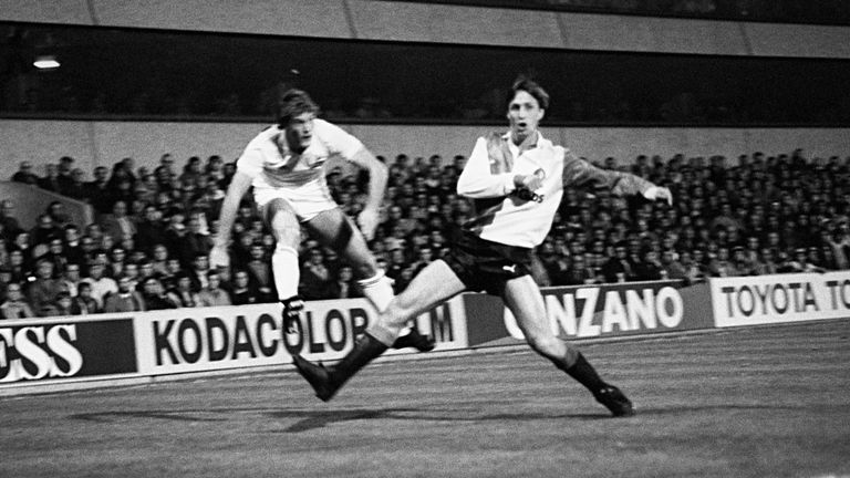 Glenn Hoddle of Tottenham whips in a cross as Feyenoord&#39;s Johan Cruyff defends in the 1984 UEFA Cup second-round clash between the sides