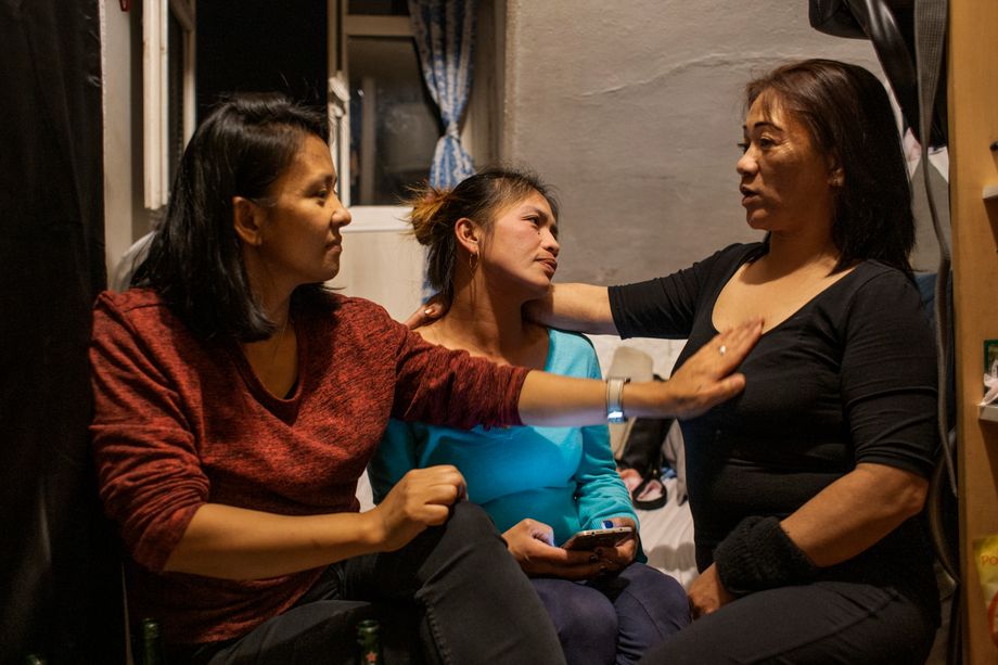 A rare moment of peace and quiet: Donna, Jhen and another friend meet up during the evening. The Filipino community in Paris is large.