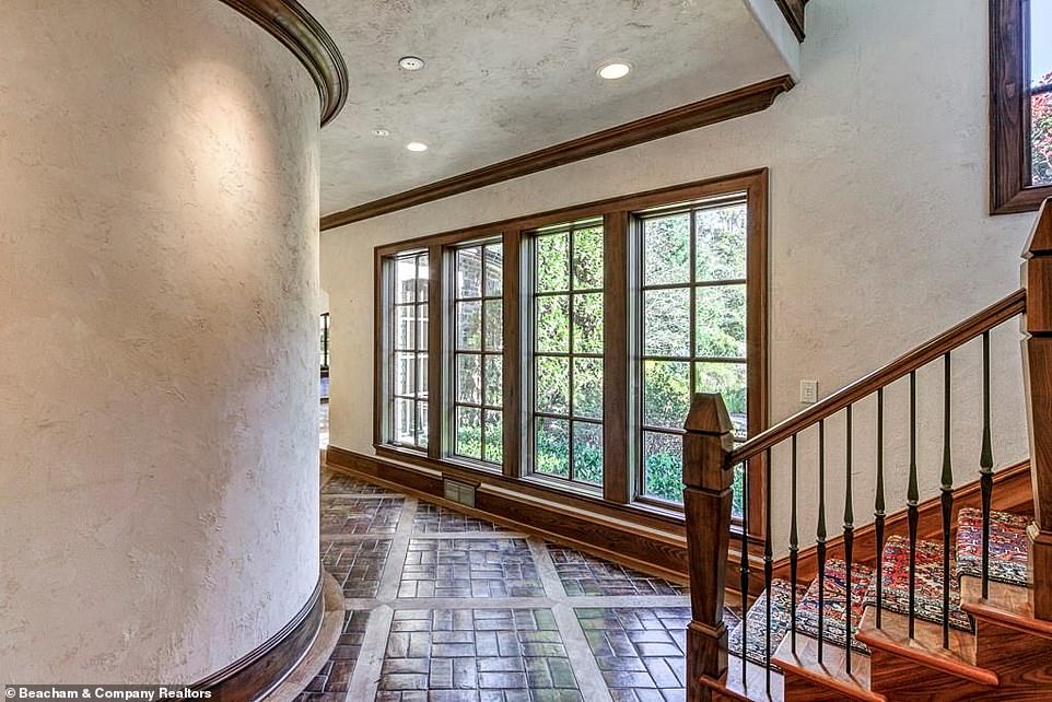 However: Some of the property also has attractive dark brick floors, including a narrow curved hallway that leads to one of the mansion's staircases