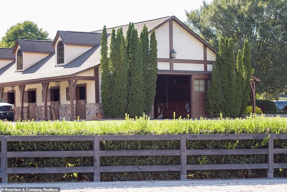 Meanwhile: Just outside the stable there is room to park a couple of cars, and nearby a dark picket fence