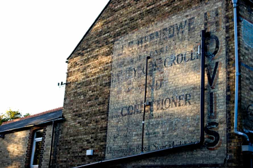 The sign for an old grocery store is still visible on the wall of this building in Oxford