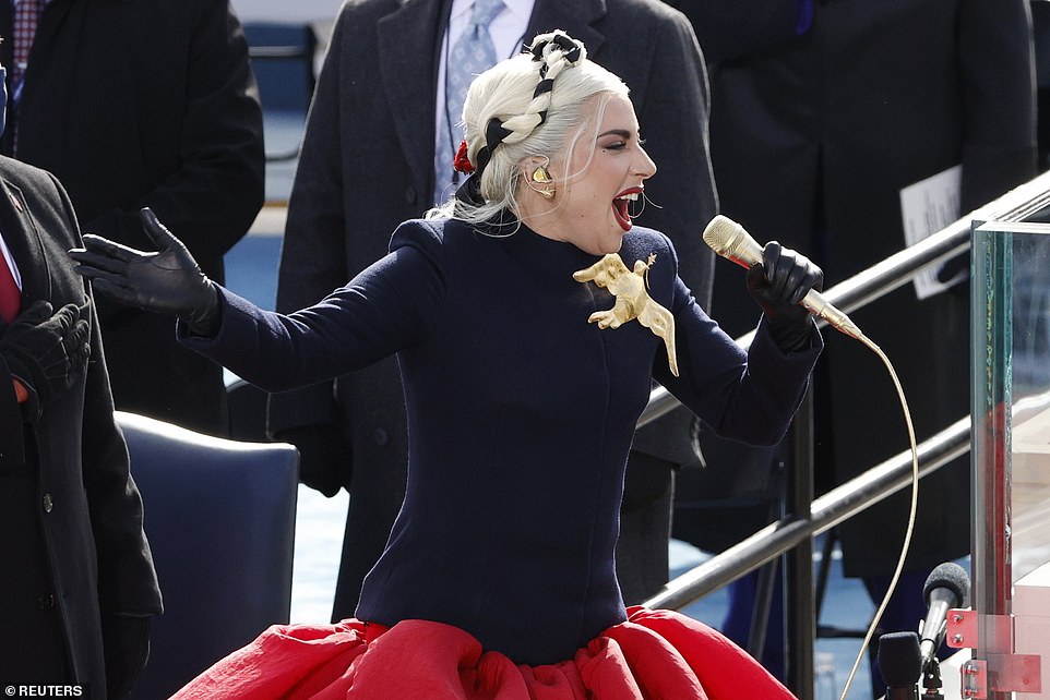 Peace: Sending a message of unity, the native New Yorker's dress was adorned with a striking gold dove, reaching out to its rivals with an olive branch in its mouth