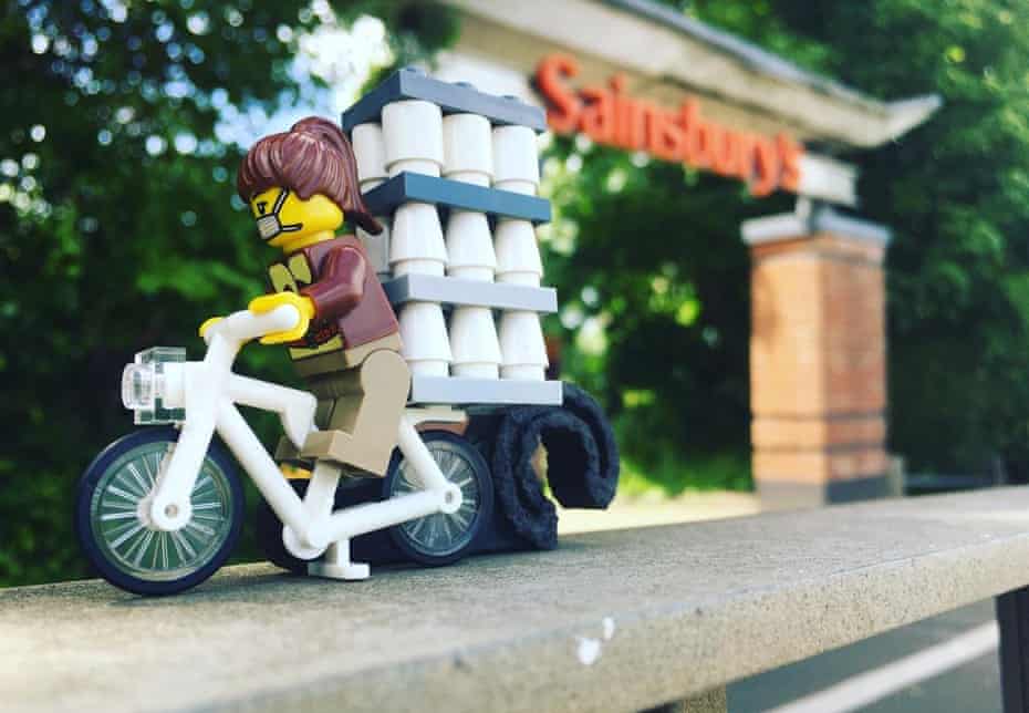 A Lego minifugure stocking up on loo rolls.