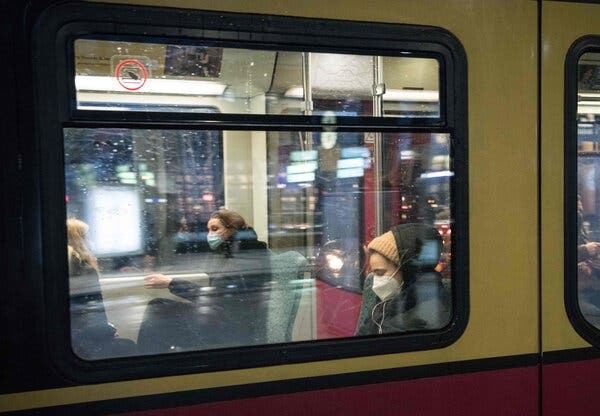 Passengers wearing protective face masks in Berlin. Requirements on public transportation tightened this week.