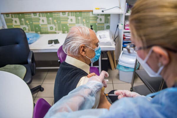 A nursing home resident receiving the Pfizer-BioNTech coronavirus vaccine in Budapest this month.