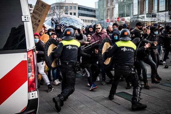 Protesters clashed with the police during a demonstration against coronavirus restrictions in Eindhoven, the Netherlands, on Sunday.