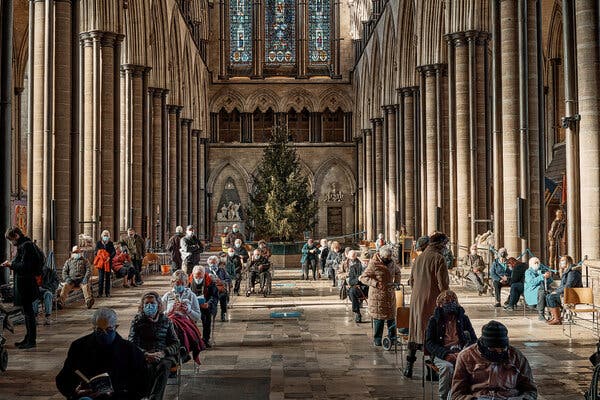 Salisbury Cathedral, which is being used as a vaccination site in Salisbury, England. Lockdowns across Britain are expected to be prolonged.