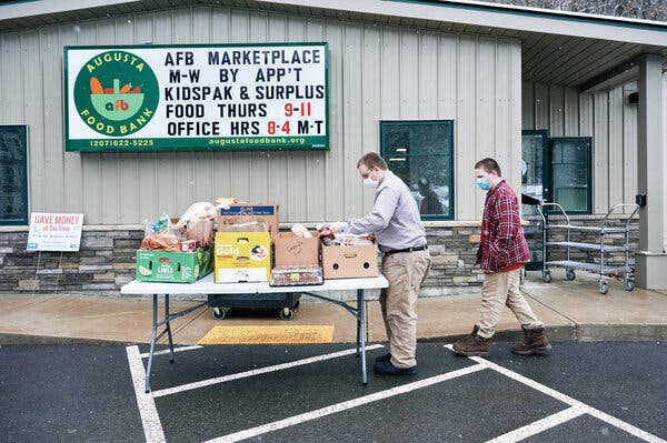 Isaac Curtis, left, picked up donations at a food bank in Augusta, Maine, on Wednesday. Mr. Curtis interviewed for a job earlier in the day.