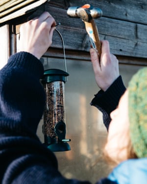 A shed is converted into a makeshift hide complete with birdfeeder