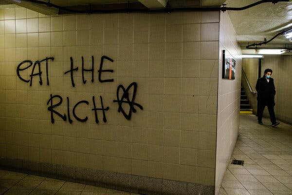 A spraypainted sign near the New York Stock Exchange. GameStop’s stock surge has been carried by a populist message.