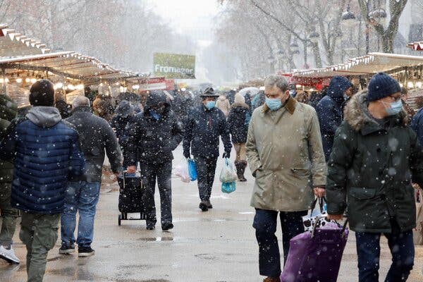 A market in Paris this month. The French economy shrank 8.3 percent overall in 2020, but performed better than expected in the October-December quarter.