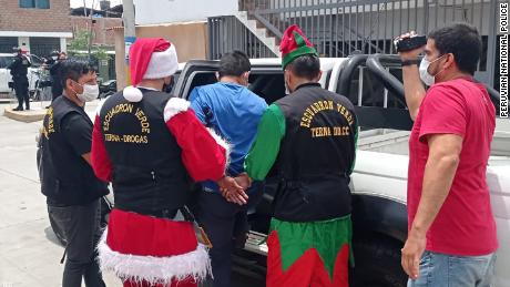 Peruvian police dress as Santa and elves for drug raid