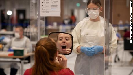 A student takes a swab for a Covid-19 test at the University of Hull in northern England on November 30, 2020.