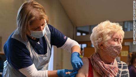 A member of the public is inoculated at a temporary vaccination center in Sheffield, northern England, on January 23.