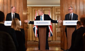 Johnson with England’s chief medical Officer, Chris Whitty (left), and his chief scientific adviser, Patrick Vallance at a press conference on 19 March.