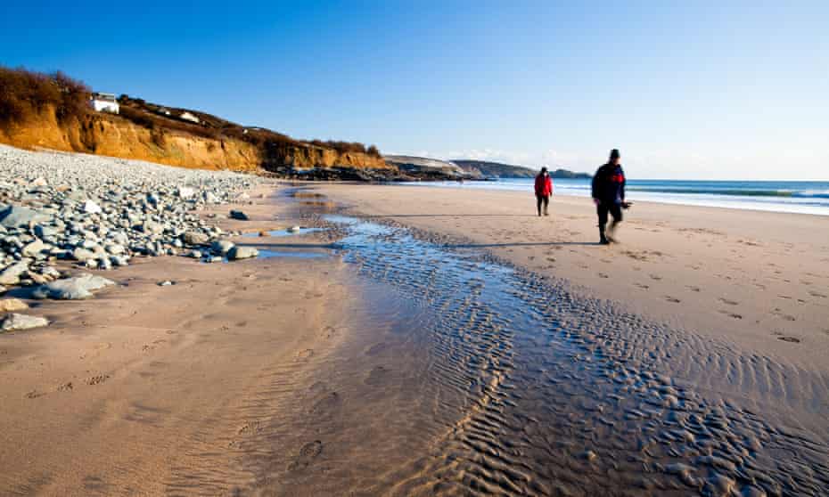 two people on Perranuthnoe beach in winter