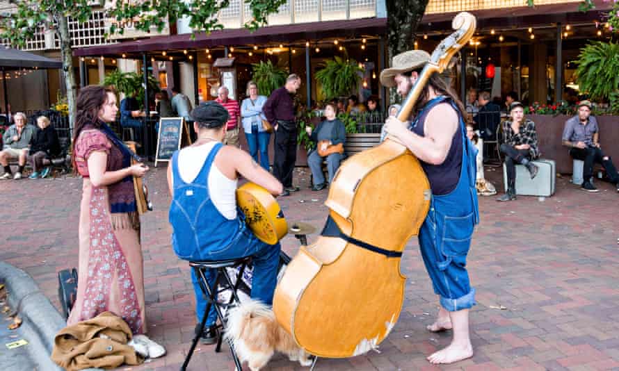 Street musicians busk in Asheville, North Carolina.