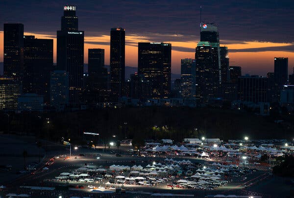 Motorists lined up for Covid-19 vaccinations and testing in the parking lot of Dodger Stadium in Los Angeles a week ago. Now California is working to streamline its vaccination process.