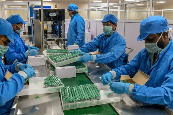 Workers at a Serum Institute of India vaccine plant in Pune, India, packed trays of the AstraZeneca-Oxford vaccine in January.