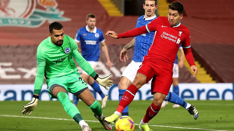 Roberto Firmino tries to get past Brighton goalkeeper Robert Sanchez