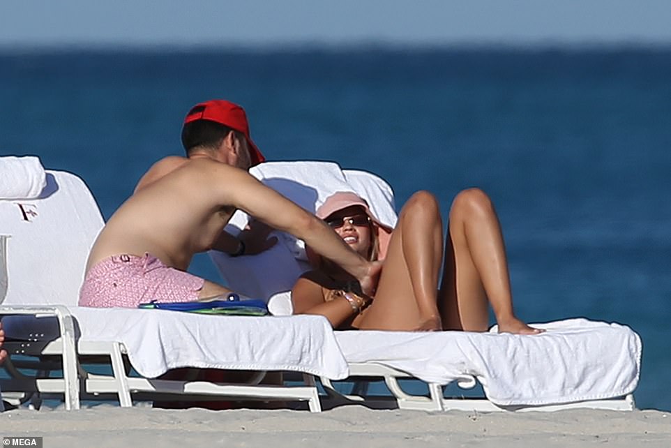 Beaming: The model looked smitten with her new beau, just two months after ending her relationship with Matthew Morton