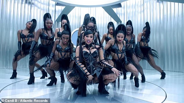 '90s throwback: Cardi topped it off with a tribute to TLC in a black leather BDSM look, as she dropped it low in an industrial silver set, à la No Scrubs