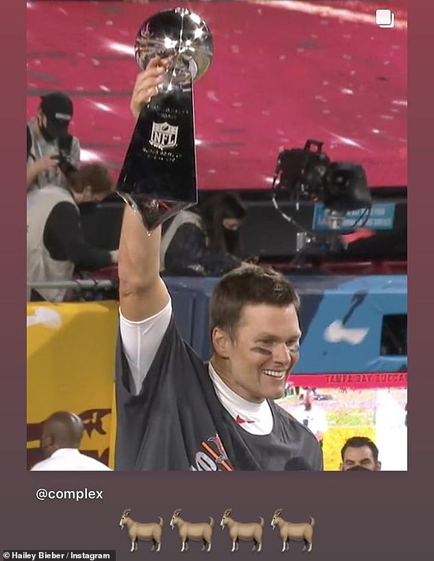 Winner winner: Hailey Bieber, 24, posted a photo of Brady holding up his trophy, along with four goat emojis on her Instagram Story