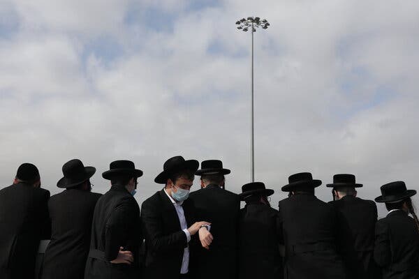 Ultra-Orthodox Jews at a funeral in Jerusalem last month. Organizations that help people leave ultra-Orthodox communities have noted a rise in demand for their services during the pandemic.