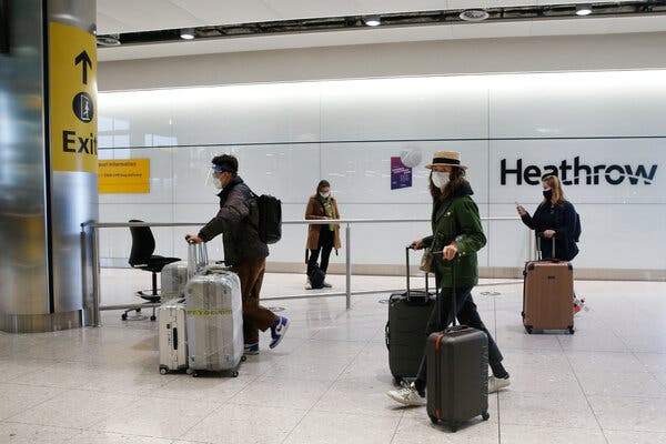 Travelers at Heathrow airport in London last month.