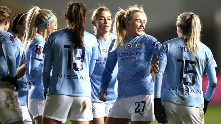 Manchester City&#39;s Lauren Hemp (right) celebrates scoring their second goal against Manchester United