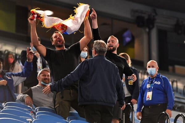 Spectators are asked to leave during a match between Novak Djokovic and Taylor Fritz at the Australian Open on Friday as the state of Victoria entered a five-day quarantine.