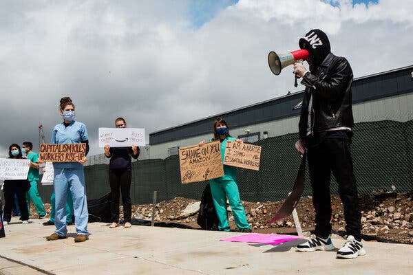 Christian Smalls speaks to a group of protestors and media as he leads a workers strike at JFK8 Amazon Fulfillment Center on May Day last year.